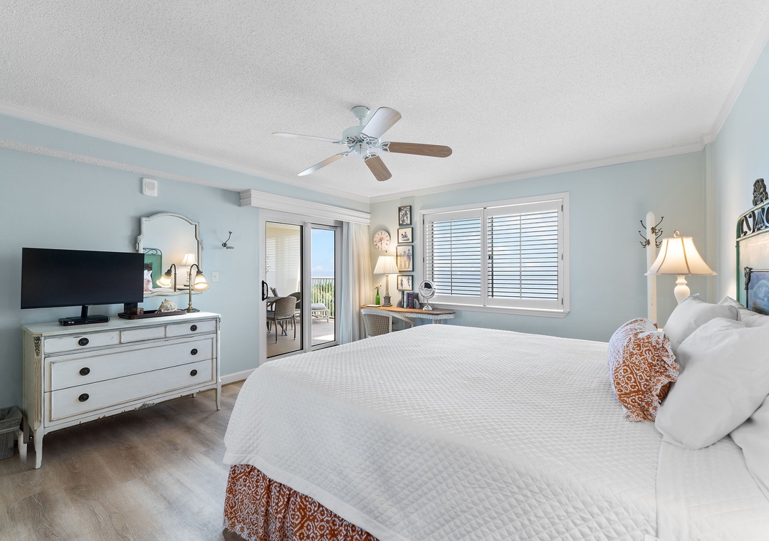 Sandy Key 338- Slip into your serene coastal retreat, where calming blue walls and crisp white linens invite you to unwind. Step through the glass door to your private balcony and breathe in the fresh air.