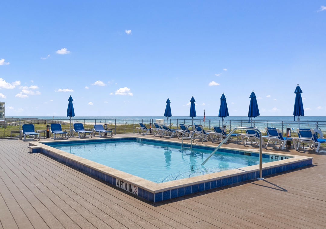 The Lost Key Beach Club Soak up the sun by the sparkling pool with unobstructed ocean views stretching to the horizon—your perfect spot for relaxation and coastal serenity.