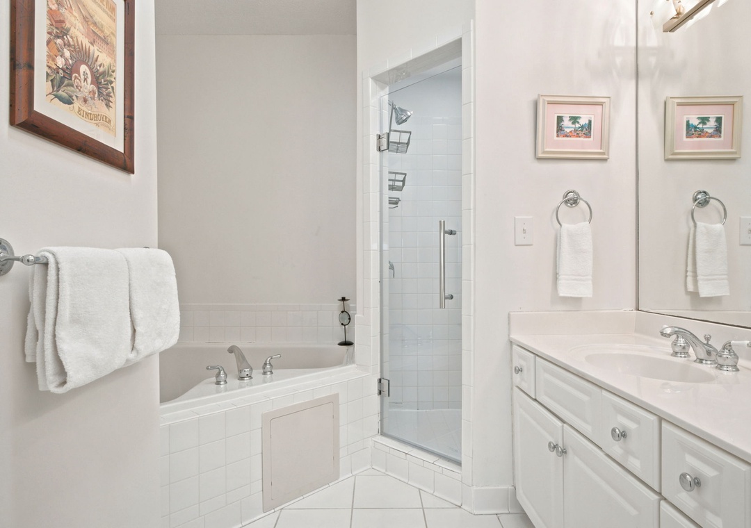 Relax in your pristine bathroom featuring a soaking tub, walk-in shower, and all the comforts you need after a day of adventure.