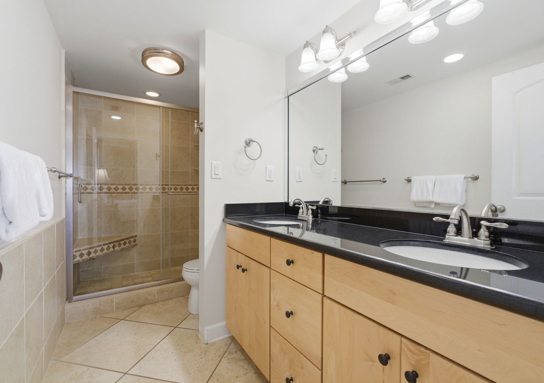 Shipwatch D803- Refresh in your private bathroom with dual sinks, a spacious walk-in shower, and thoughtful touches like grab bars and fresh towels for your comfort.