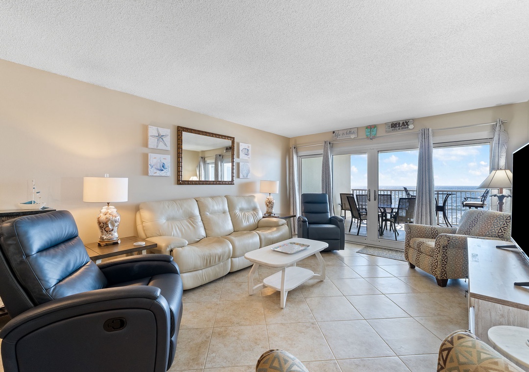 Sandy Key 628- Sink into plush seating and let the ocean breeze drift through your private balcony—this welcoming living space opens straight to sweeping water views you'll never tire of.