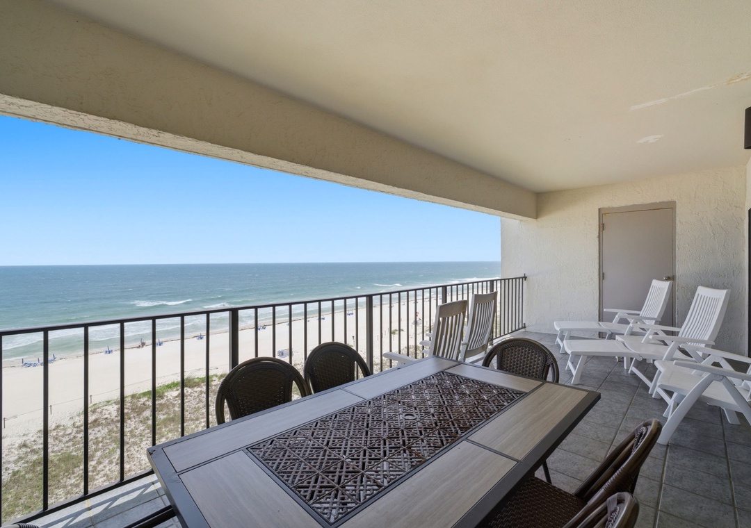 Shipwatch D803- Spacious balcony with unobstructed ocean views, offering ample seating for outdoor dining and relaxation. Watch the waves, feel the sea breeze, and unwind in your private coastal retreat.