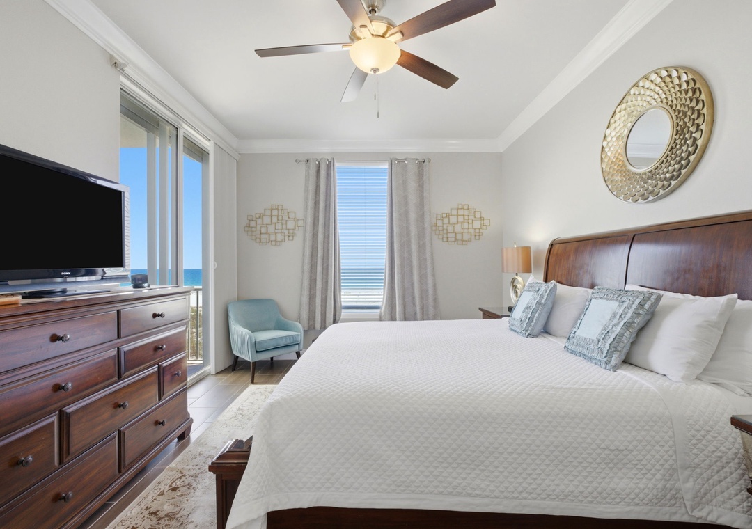 Wake up to stunning ocean views from your bed. This serene bedroom invites you to unwind with coastal elegance, luxurious linens, and calming sea breezes just beyond your window.