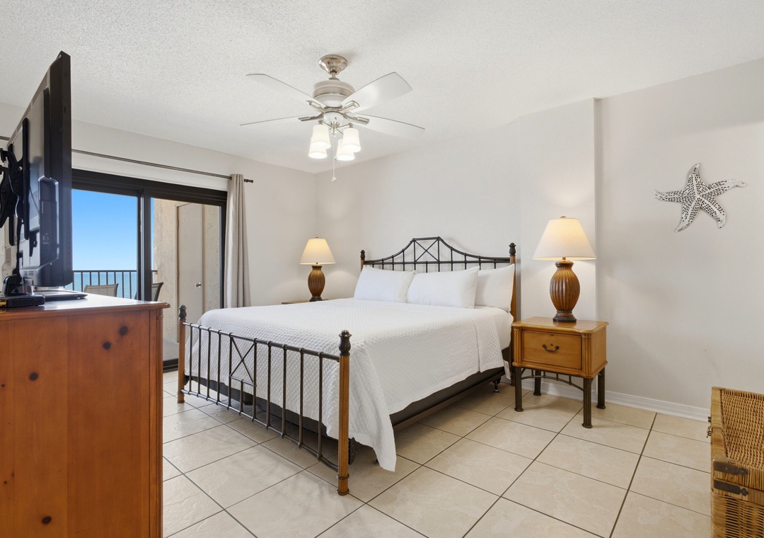 Ocean Breeze E702- Unwind in your bright, coastal-themed bedroom with a comfortable bed and ocean views just beyond your private balcony—your perfect seaside retreat awaits.