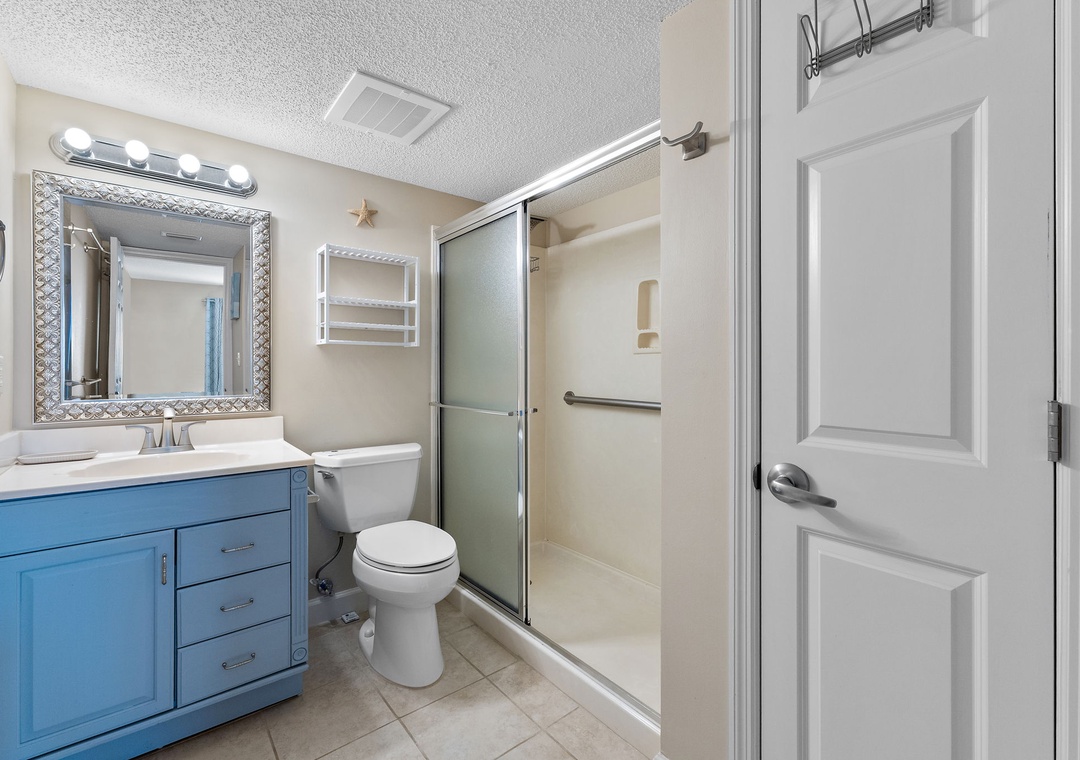 Sandy Key 628- Step out of the shower and into a fresh start to your day in this bright, cheerfully updated bathroom with coastal-inspired touches and everything you need within reach.