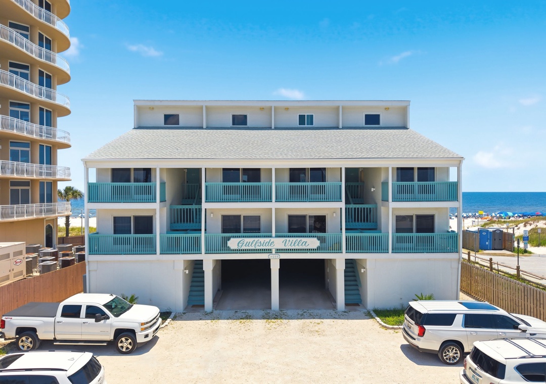 Gulfside Villas - Beachside property with convenient parking and direct access, offering multiple units with balconies overlooking the ocean and nearby shoreline.