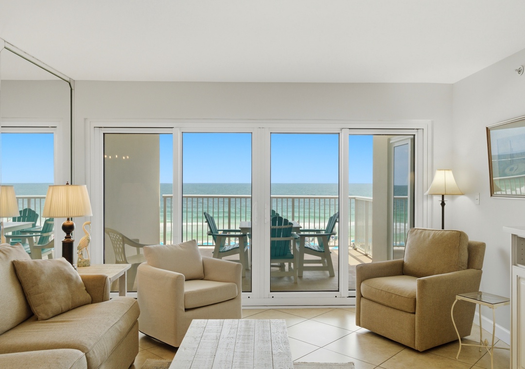 Sandy Key 318- Unwind in your bright, airy living space where floor-to-ceiling glass doors frame stunning sea views and open to your private balcony overlooking the beach.