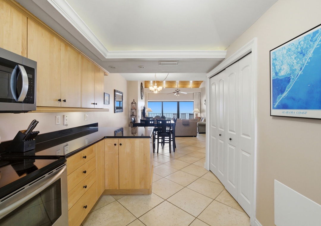 Shipwatch D803- Your modern kitchen opens seamlessly into the living and dining areas, where ocean views await through expansive windows. Everything you need to cook and relax in comfort is right at your fingertips.