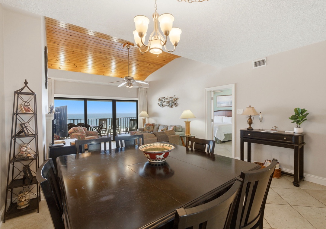 Shipwatch D803- Gather for meals at your spacious dining table while enjoying ocean breezes through the open balcony doors, where sunlight streams into your beautifully appointed living space with vaulted wood ceilings.
