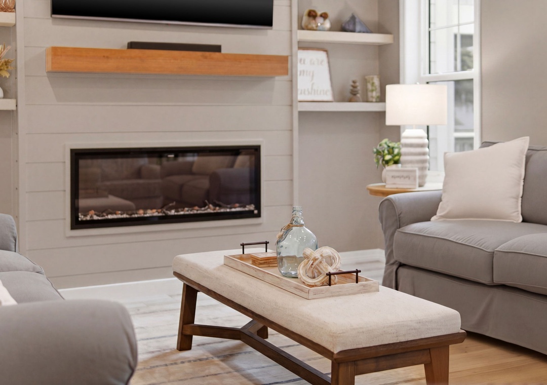 Turtles Nest- Sink into plush seating by the warm glow of the fireplace, where your favorite shows await on the wall-mounted TV and soft natural light fills your peaceful retreat.