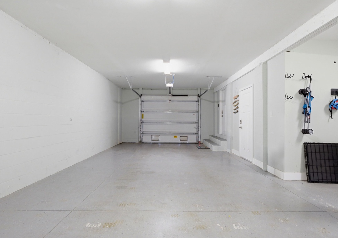 A spacious garage provides secure parking and storage space for your convenience during your stay.