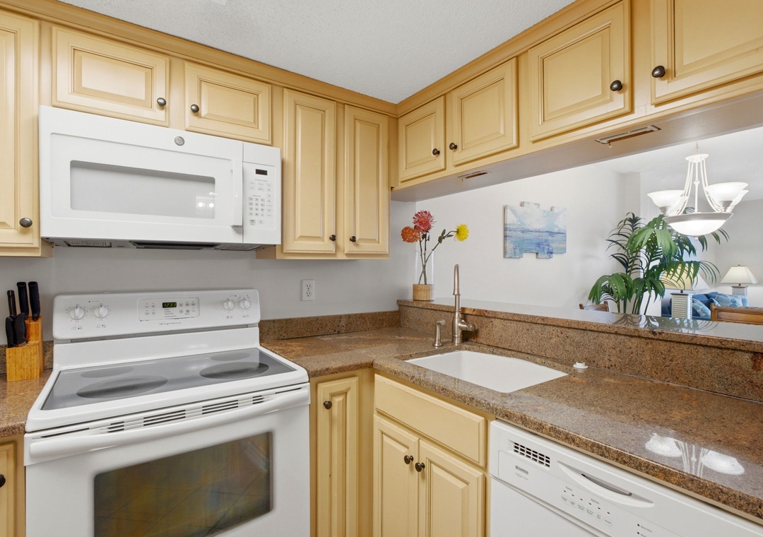Ocean Breeze E702- Your fully equipped kitchen features granite countertops, modern appliances, and everything you need to prepare delicious meals during your stay.