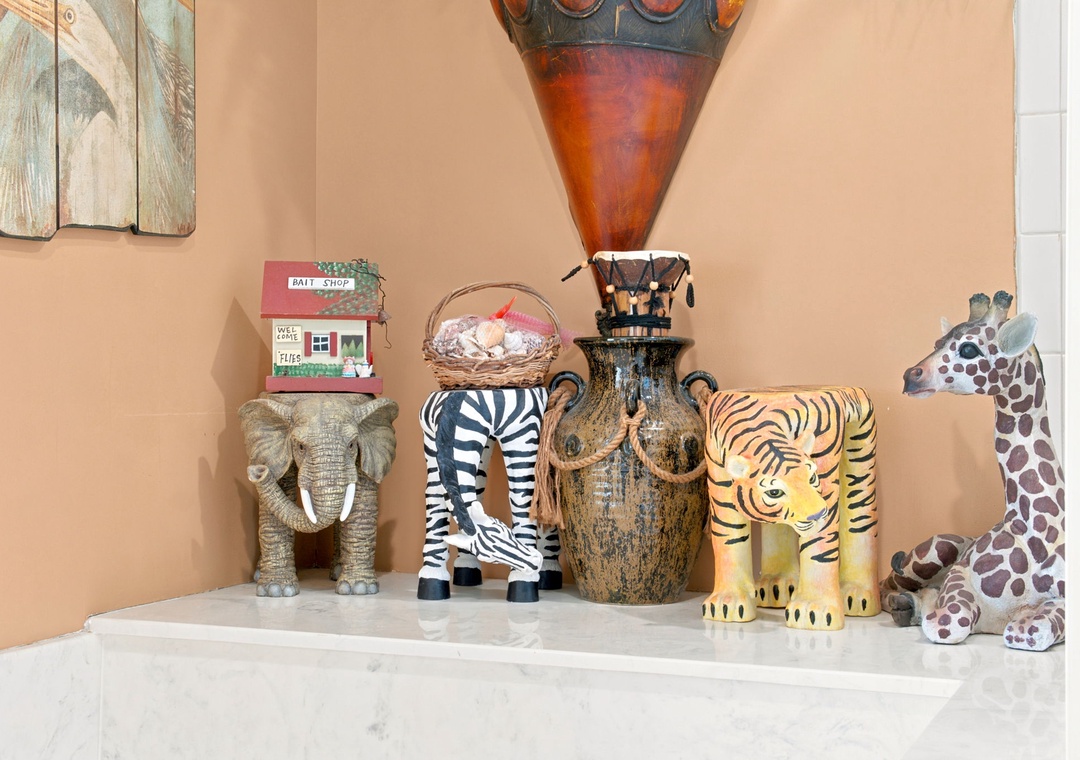 Beach Colony W13A- Safari-themed décor adds playful character to your space, featuring whimsical animal figurines and artisan pieces that create a warm, inviting atmosphere perfect for families.