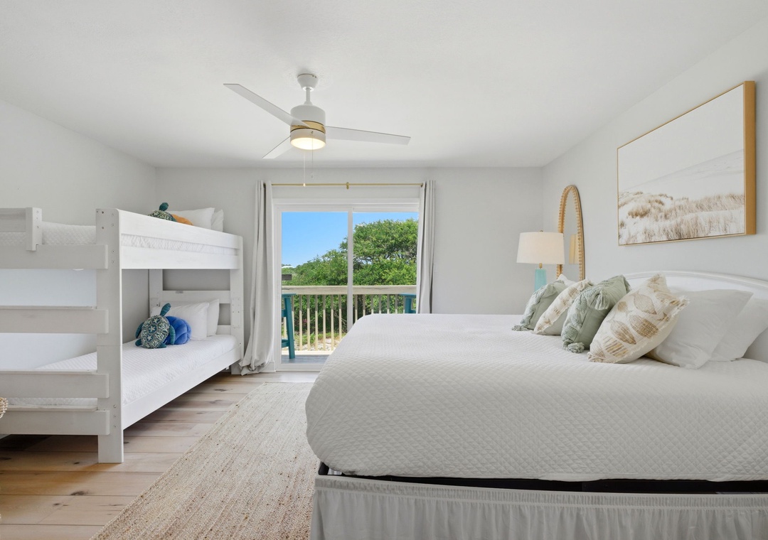 North Lost Key Landing B2- Rest peacefully in this coastal-inspired bedroom where crisp white linens, gentle sea-glass tones, and natural textures create your serene retreat with garden views from your private balcony.