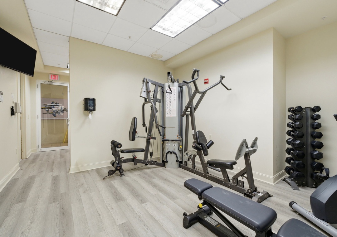 Stay active during your getaway in this well-equipped fitness center, featuring a versatile multi-station gym and free weights to keep your workout routine on track.