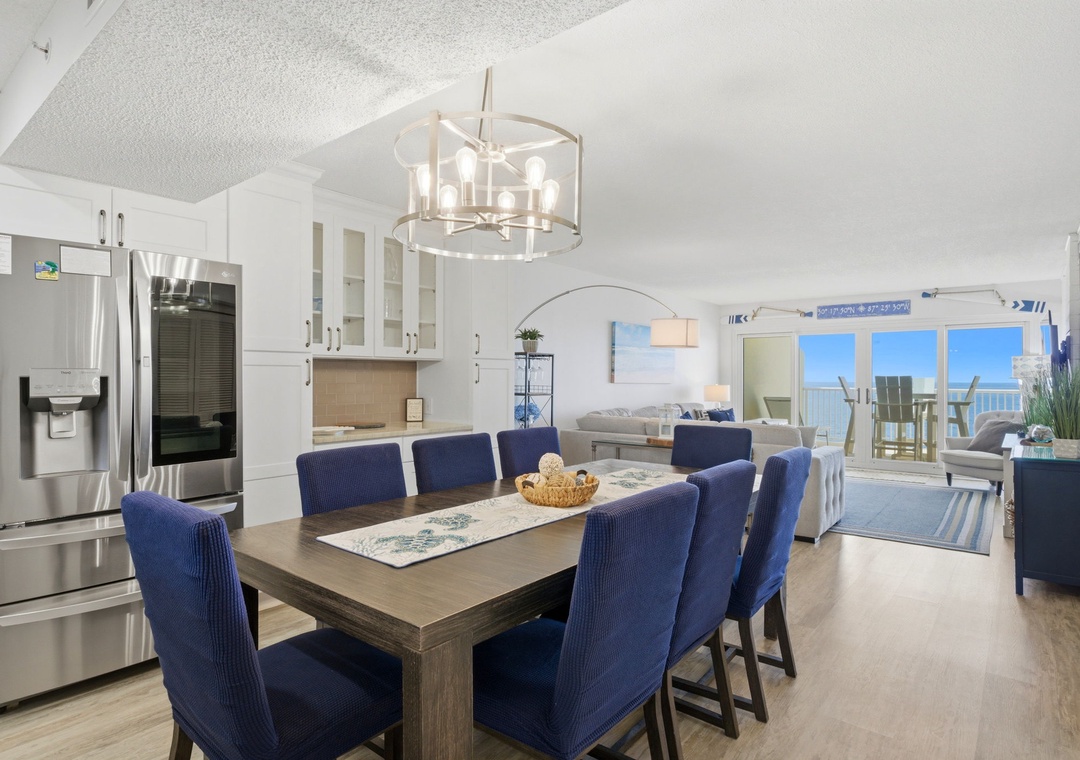 Gather around this elegant dining table for meals together, with a modern kitchen at your side and bright ocean views flowing through your open-concept space.