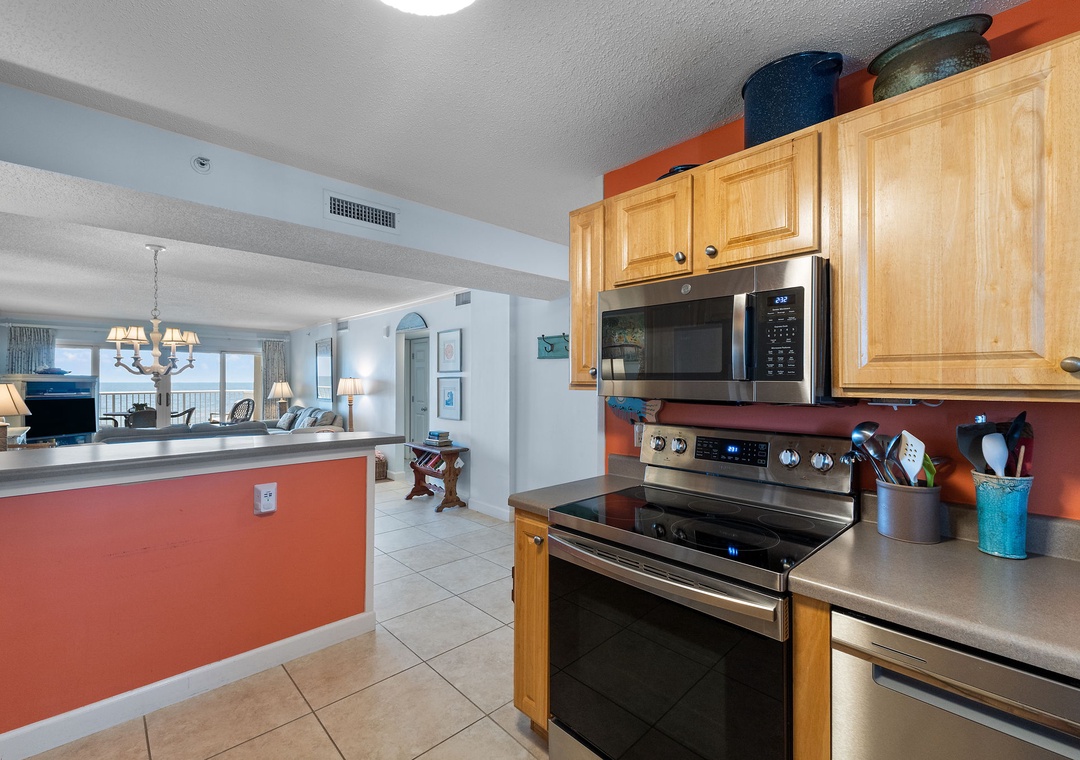 Sandy Key 338- Step into your fully-equipped kitchen with modern appliances and ocean views beyond. Cook meals with ease while enjoying the coastal atmosphere flowing through your open-concept space.