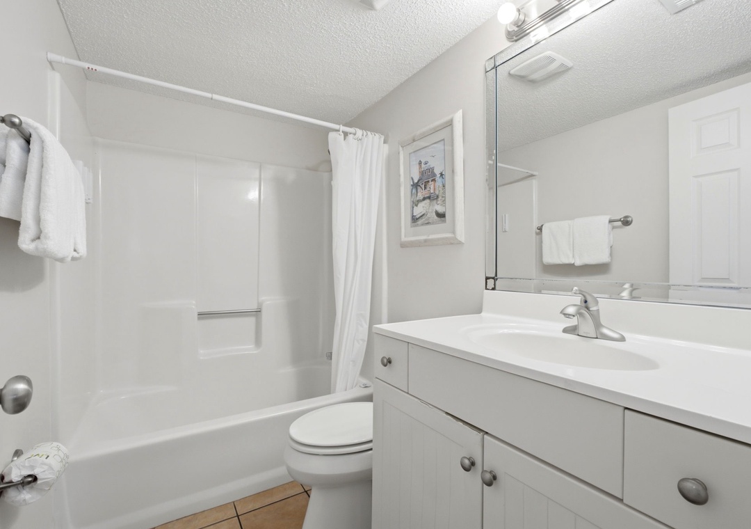 Ocean Breeze E702- Step into your bright, freshly updated bathroom with a sparkling tub-shower combo, crisp white linens, and plenty of counter space to spread out and feel right at home.