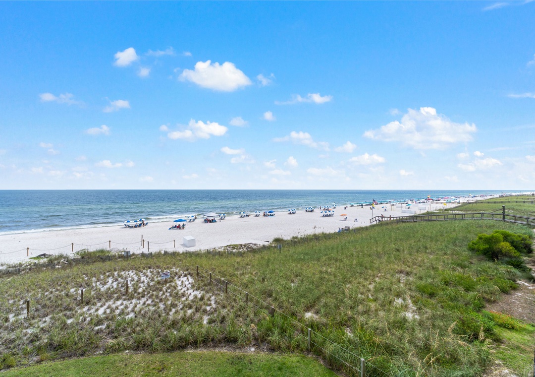 Sandy Key 338- Sandy beaches and endless blue skies await just steps from the property, offering a perfect coastal escape.