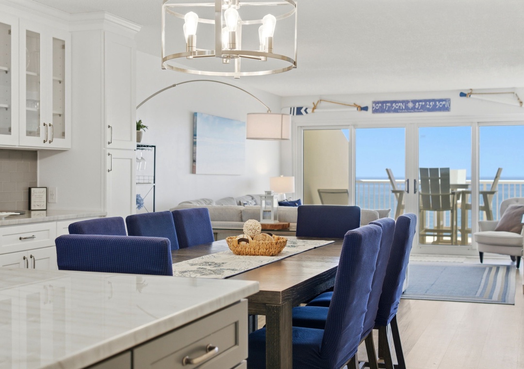 Step inside your bright coastal retreat where nautical touches blend with modern elegance. Gather around the inviting dining table, unwind in the airy living space, and soak in stunning ocean vistas right from your balcony.