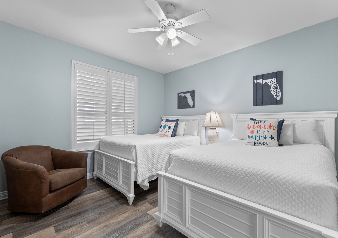 Beach Colony Tower 10C- Unwind in your peaceful coastal retreat with two plush queen beds, a cozy reading chair, and soothing ocean-inspired décor that invites restful sleep.