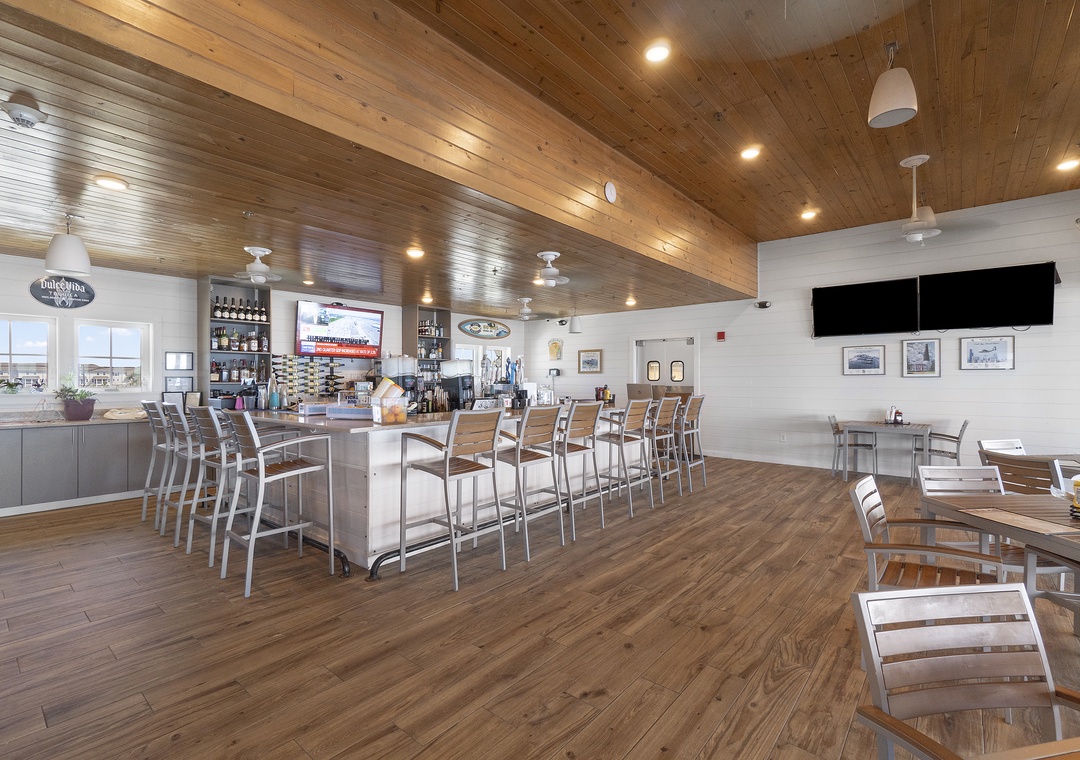 The Lost Key Beach Club A welcoming restaurant and bar space with rustic wood finishes, spacious seating, and natural light perfect for dining and relaxing after your beach adventures.