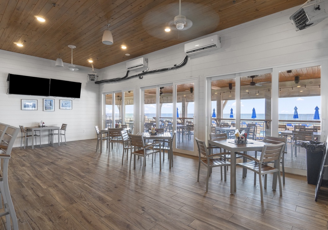 The Lost Key Beach Club This bright communal dining space flows onto an ocean-view deck where blue umbrellas and coastal breezes set the tone for your perfect beach getaway.