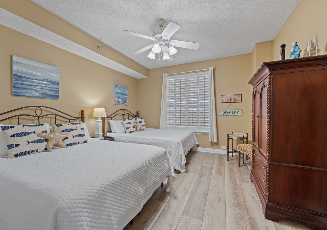 Beach Colony T15B- Drift off in this cheerful twin bedroom with nautical touches, ceiling fan, and crisp linens to help you unwind after a day by the shore.