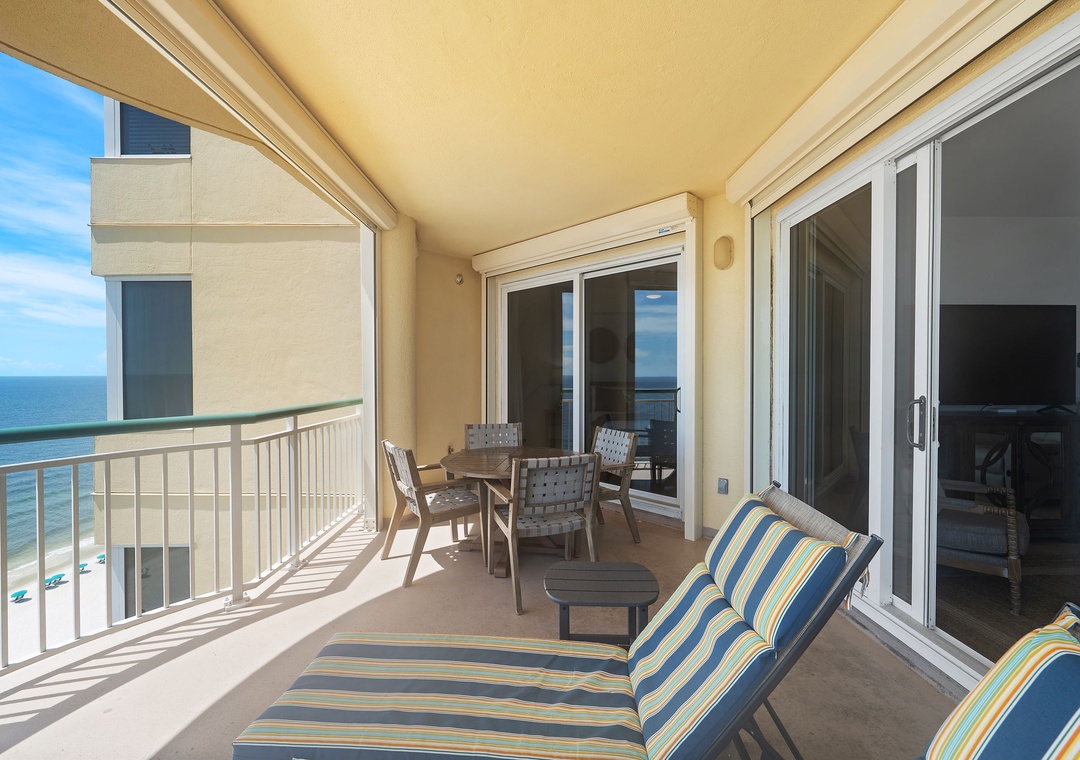 Beach Colony T14B- Sink into your private balcony lounge chairs and let the ocean breeze wash over you. With a dining table for beachfront meals and endless views of white sand and turquoise waves, this is your personal slice of paradise.