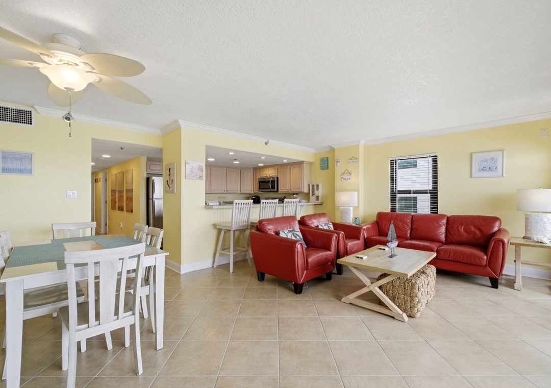 Ocean Breeze E601- Settle into your inviting open-concept living space, where sunny yellow walls and coastal charm create a cheerful, relaxing atmosphere. You'll love the seamless flow from dining to kitchen to living area—perfect for your beach vacation.