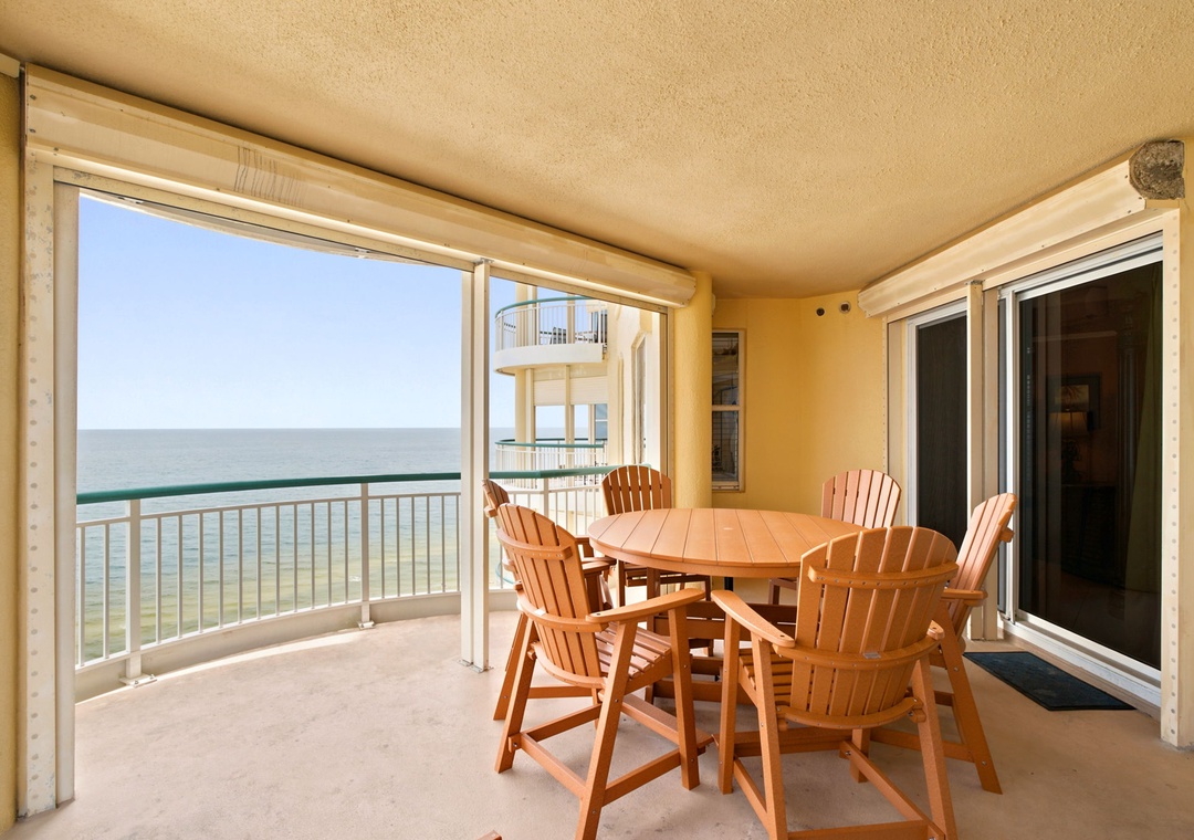 Beach Colony W13A-Enjoy oceanfront dining on your private balcony with sweeping sea views and refreshing coastal breezes at your fingertips.