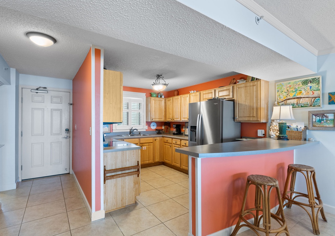 Sandy Key 338- Step into your bright, beachy kitchen with warm coral accents and ample counter space for preparing family meals. Pull up a stool at the breakfast bar and plan your day over morning coffee.