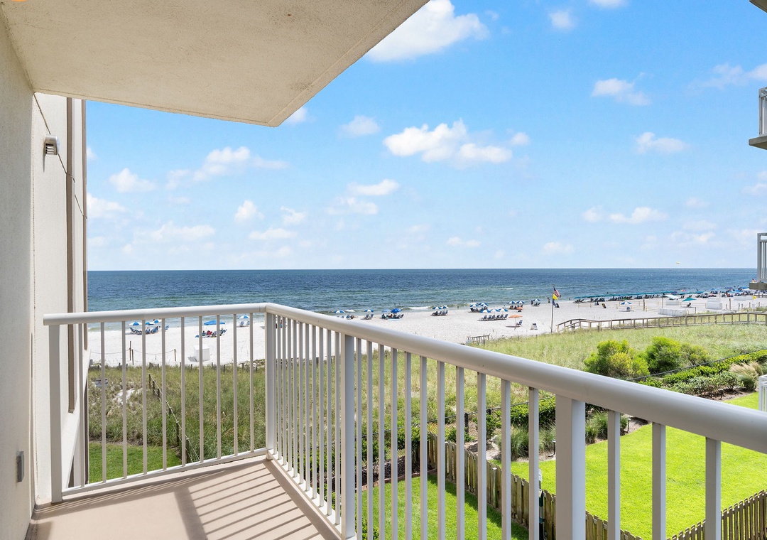 Sandy Key 338- Step out onto your private balcony and let the ocean breeze welcome you to paradise. The sandy shore and sparkling waves are just steps away, inviting you to unwind in this beachfront escape.