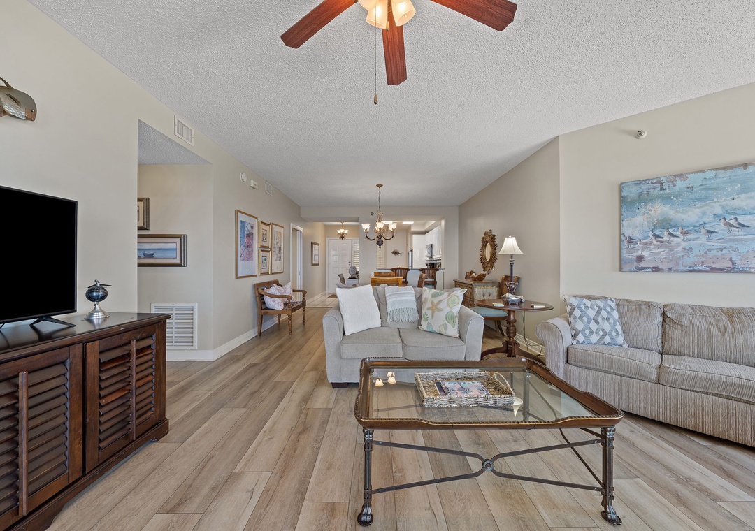 Beach Colony T15B- Step into your beautifully appointed living space where coastal charm meets modern comfort. Vaulted ceilings, stylish furnishings, and an open floor plan create an inviting retreat for relaxing after your day of exploration.
