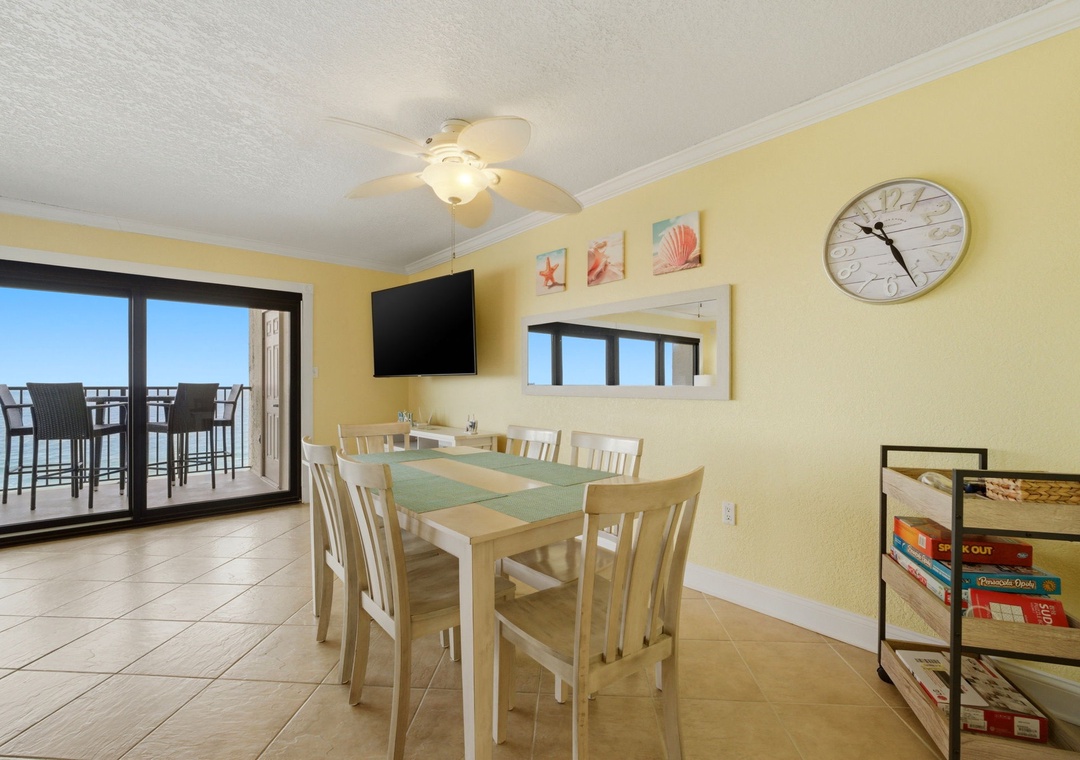 Ocean Breeze E601- Gather around this bright dining space where beach-themed artwork and coastal breezes invite you to share meals with a stunning sea view just beyond your balcony.