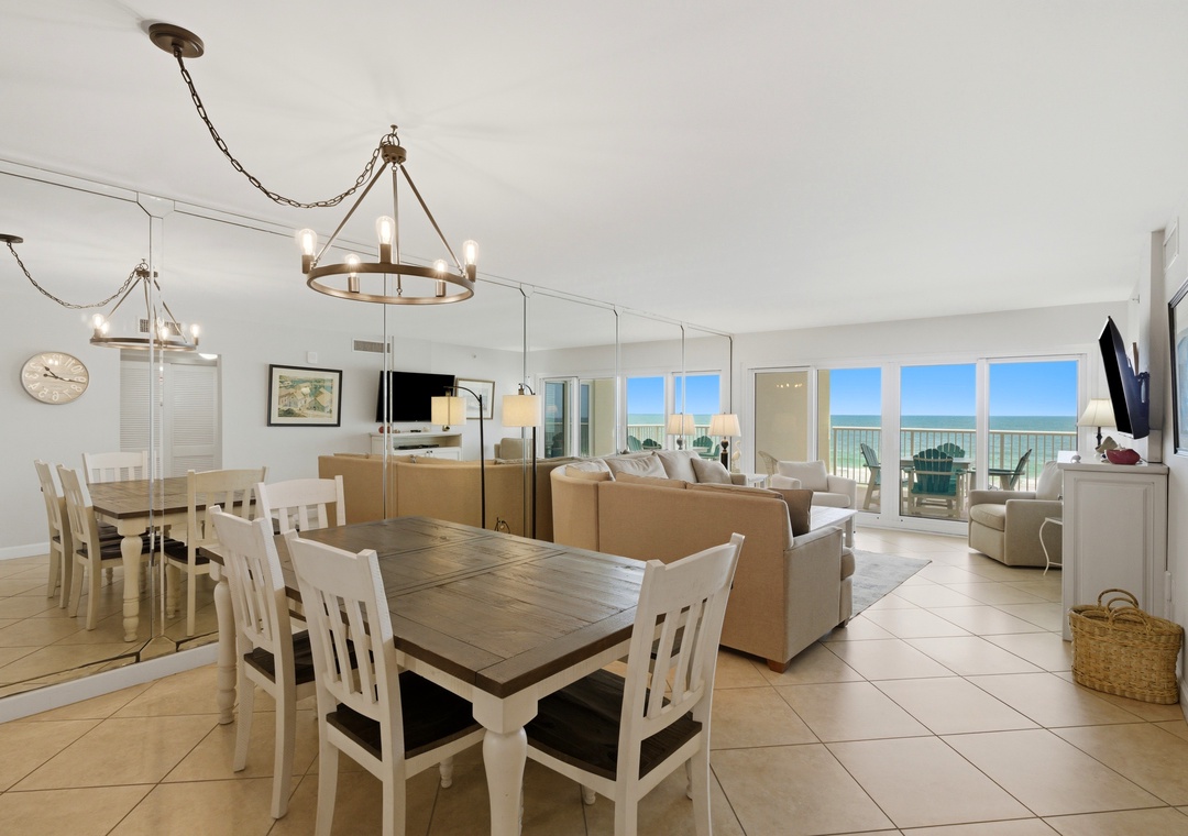Sandy Key 318- Bright, airy living space with stunning ocean views through expansive windows. The open-plan design invites you to unwind, dine, and enjoy coastal living at its finest.