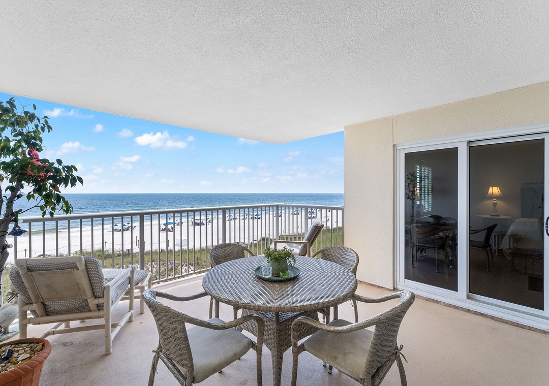 Sandy Key 338- Step onto your private balcony and soak in breathtaking sea views stretching to the horizon. Gather around the woven dining table for morning coffee or sunset cocktails as gentle ocean breezes drift through your beachfront retreat.
