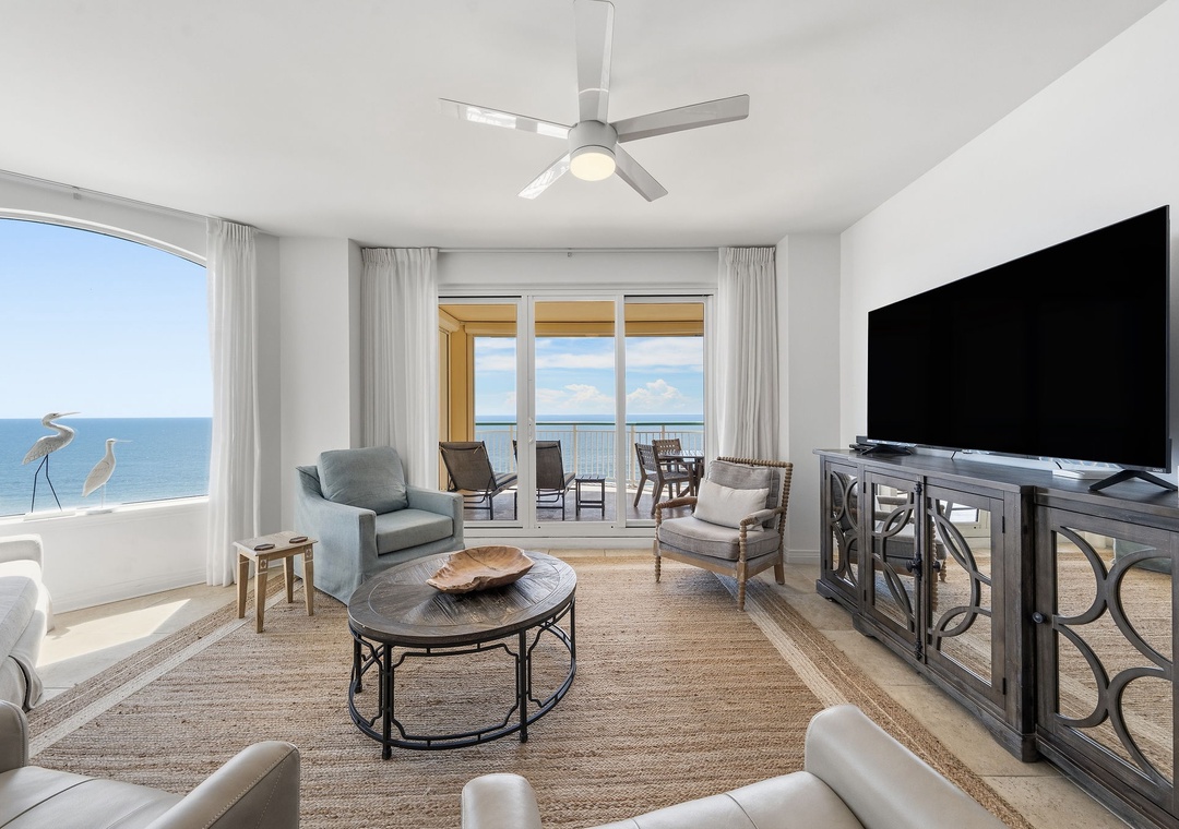 Beach Colony T14B- Relax in your bright, coastal living room where ocean breezes and stunning sea views set the scene for your perfect beach escape. Sink into plush seating and let the calming blues outside melt your stress away.