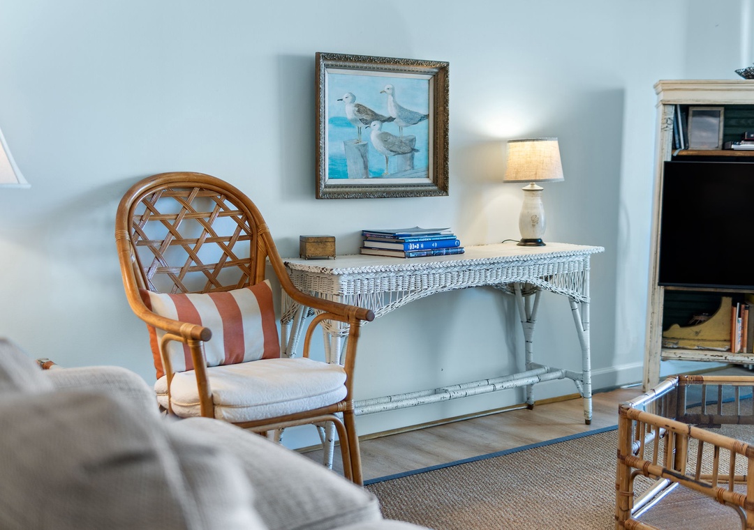 Sandy Key 338- Settle into your quiet coastal corner, where seagull art and a charming wicker desk create a breezy, beachy vibe that feels instantly relaxing.