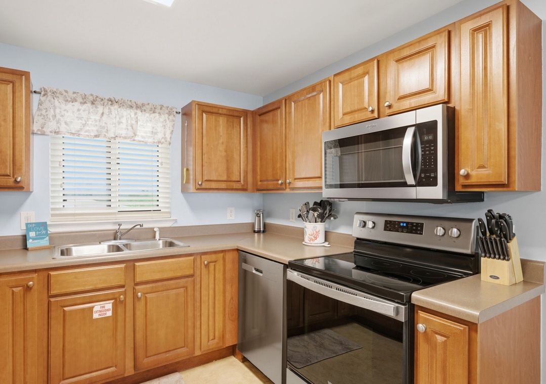 Sandy Key 637- Your fully equipped kitchen features warm wood cabinetry, modern stainless steel appliances, and everything you need to prepare delicious meals during your stay.