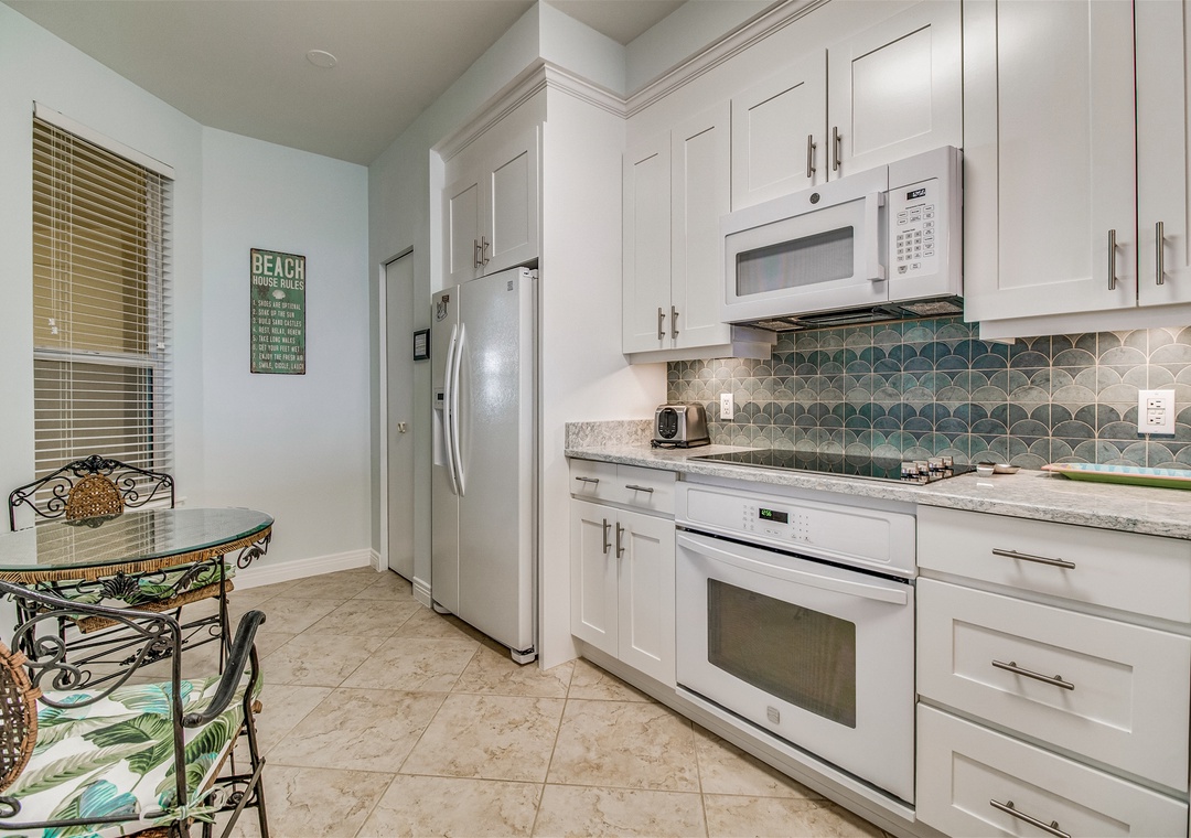 Beach Colony West 9B Kitchen Refrigerator, Stove, and Microwave