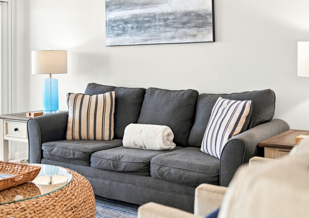 Sandy Key 411- Sink into this plush sofa with coastal-inspired accents and soft throws waiting just for you. Natural light fills your space, creating a serene retreat after a day of adventure.