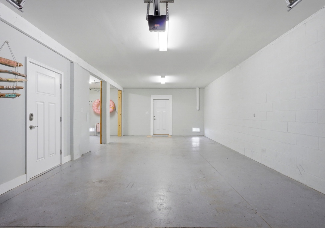 Spacious garage with automatic door opener, bright lighting, and direct entry to your rental—plenty of room for your vehicles and gear.