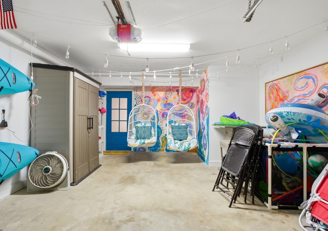 North Lost Key Landing B2- Your adventure hub awaits with hanging chairs, kayaks, beach gear, and vibrant art—everything you need for an unforgettable coastal escape.