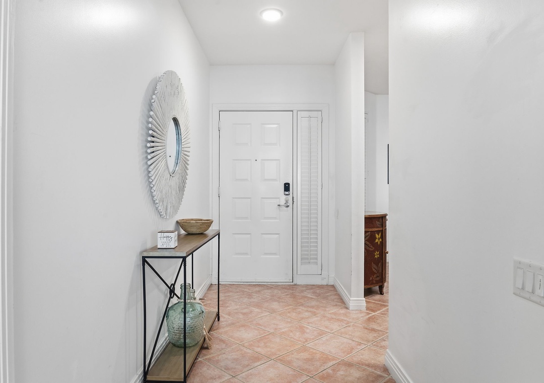 Beach Colony T14B- Step into a bright, inviting entryway with warm tile floors and thoughtful décor that welcomes you home after your adventures.