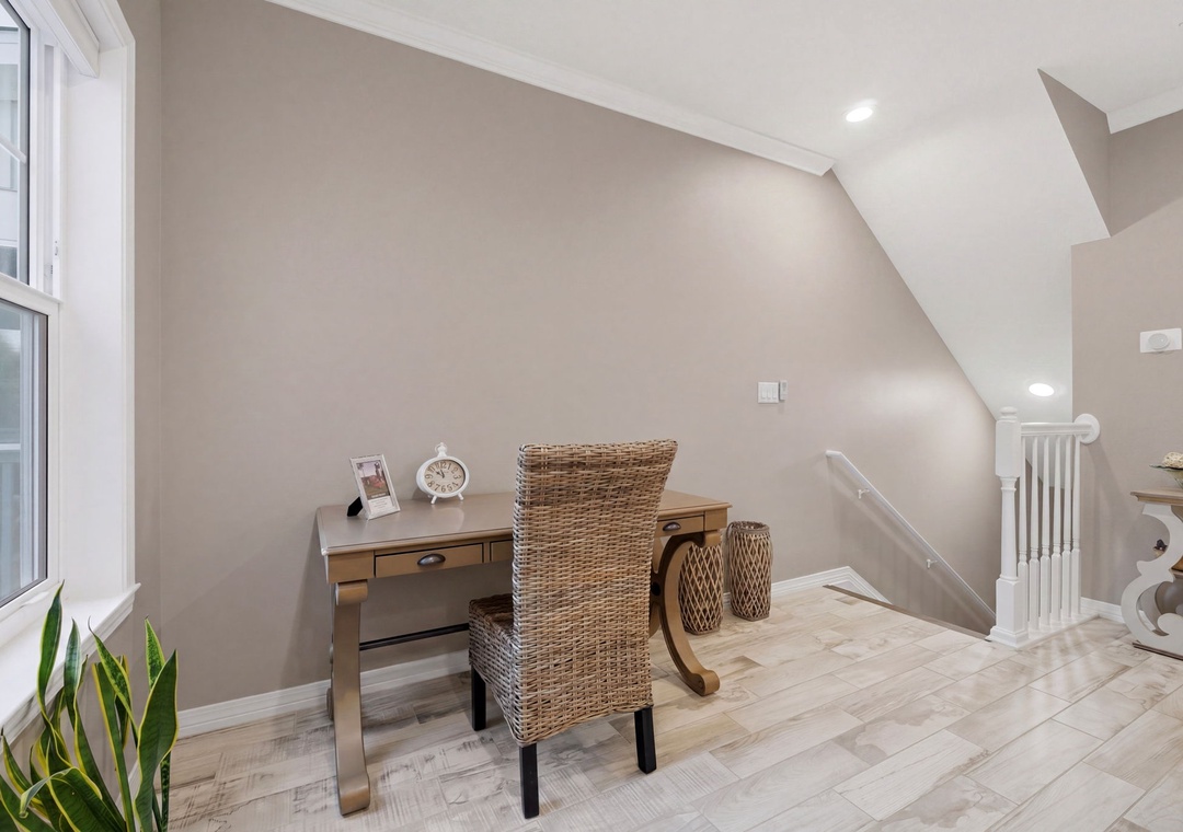 Turtles Nest- Your private workspace awaits—a sun-lit nook with a cozy wicker chair and desk, perfect for morning coffee or catching up on emails in peaceful comfort.