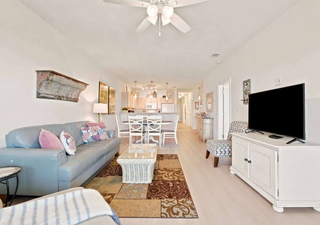 Unwind in your bright, breezy open-plan living space where soft coastal colors and thoughtful decor create a welcoming retreat for memorable vacation moments.