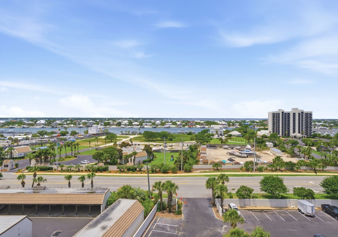 Shipwatch D803- Scenic view showcasing the property's waterfront location with tropical landscaping, nearby parks, and a tranquil coastal setting under blue skies.