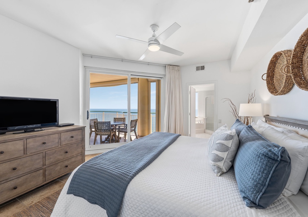 Beach Colony T14B- Wake up to ocean breezes and coastal charm—your bed faces glass doors opening to a private balcony with stunning sea views, blending relaxation with natural beauty.