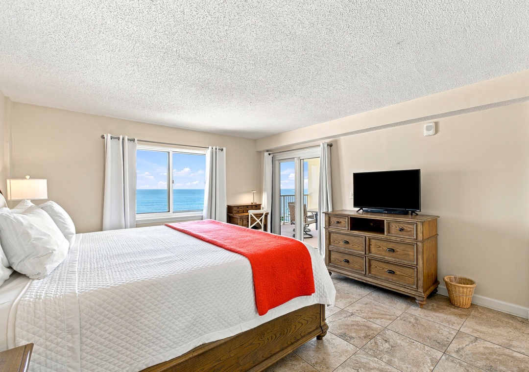 Sandy Key 411- Wake up to stunning ocean views right from your bed—this serene room features a comfortable retreat with direct access to the balcony, where the sea is always in sight.